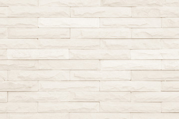 Cream and white brick wall texture background.
