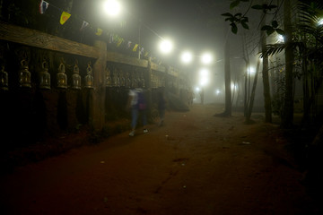 Chanthaburi, Thailand: Mar, 03,2019 , Foggy night People are worshiping the footprint in the rock on the top of Kitchakut Mountain