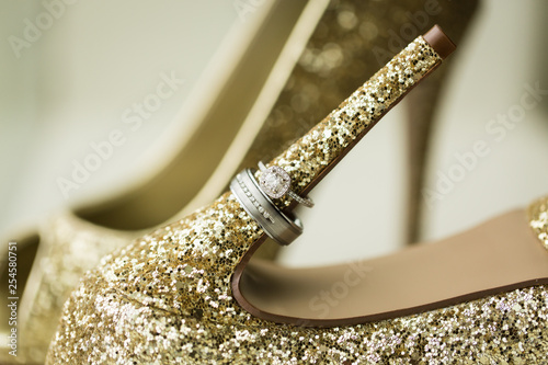 Wedding Rings On Gold Shoes Stock Photo And Royalty Free Images On