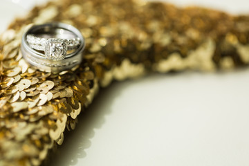 Wedding Rings on Gold Sequin