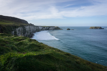 Fototapeta na wymiar The eastern rocks of the east coast of Ireland washed by fresh salt sea