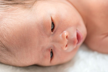 close up face of newborn baby
