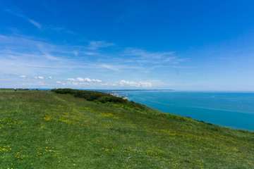 Fototapeta na wymiar soft green cliff over the sea on an amazingly sunny English day