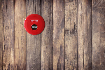 fire break glass alarm switch on the old wood wall texture. background old panels