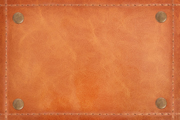 Brown leather stitched large thread and pins on Leather texture background