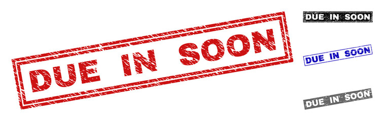 Grunge DUE IN SOON rectangle stamp seals isolated on a white background. Rectangular seals with grunge texture in red, blue, black and gray colors.