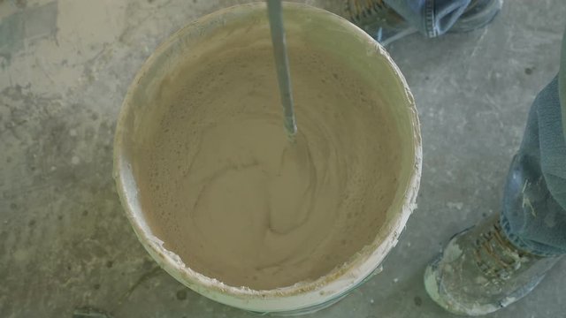 Mixing plaster for drywall on a home remodeling job