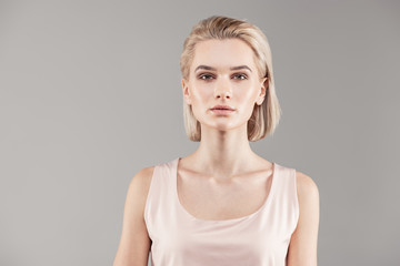 Appealing young lady with bob haircut and grey eyes