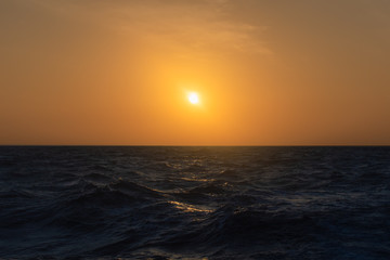 Fototapeta premium Sunset over Blue Ocean