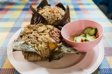 Close up rice wrapped in lotus leaf.Zongzi in lotus leaf, Chinese Rice Dumplings in local market.