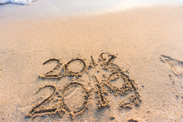 2019 Happy new year on seashore sand beach sunset colorful sky, Element of photo design