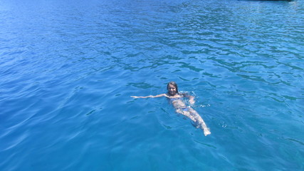 girl swims in the sea