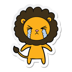 sticker of a cartoon crying lion