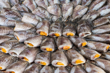 Close up Fishes (Trichogaster pectoralis) arrange on rattan in market.Raw food ingredients.