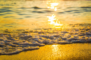 Amazing sea wave close up on beach sunset