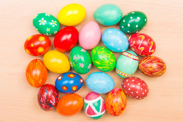 Easter background with handmade colored eggs. Top view. Festive tradition