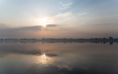 Fototapeta na wymiar Fog at sunrise on Nile