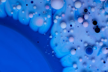 abstract background of stains and paint bubbles in liquid