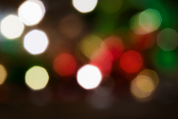 Photos of the Christmas tree lights garlands in the form of defocus and bokeh