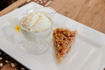 Crispy apple crumble pie with vanilla ice cream