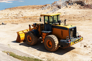 Yellow bulldozer overcome barrier