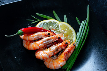 Grilled prawns with chili pepper. Royal delicious and beautiful shrimp. Flatley. Food background