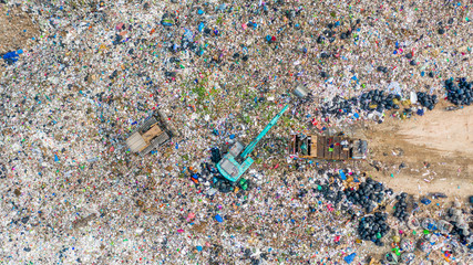 Garbage pile  in trash dump or landfill, Aerial view garbage trucks unload garbage to a landfill, ...