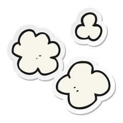 sticker of a cartoon puff of smoke