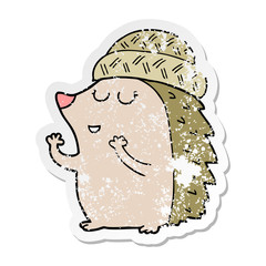 distressed sticker of a cartoon hedgehog wearing hat