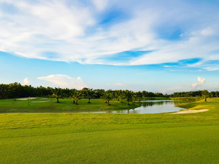 Beautiful fairway  sand bunkers and lake  in the golf course  northern of Thailand with sky background