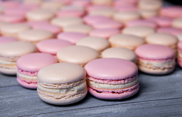 Close up colorful macarons dessert with vintage pastel tones French colorful macarons background, close up macaron or macaroons cookie, tasty dessert. food background