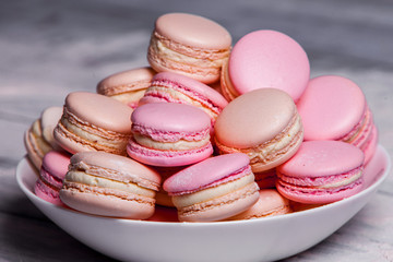 macaron or macaroons cookie, tasty dessert. food background Plate of fresh colorful macarons. 