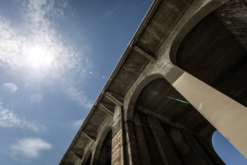 concrete bridge against blue sky