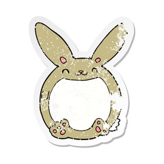 distressed sticker of a cartoon rabbit