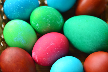 Easter painted eggs. Multicolored. Lots of chicken eggs and one goose egg. Preparation for the holiday.
