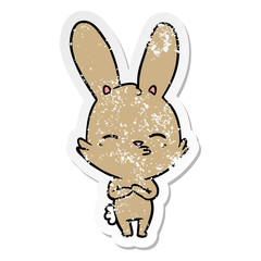 distressed sticker of a curious bunny cartoon