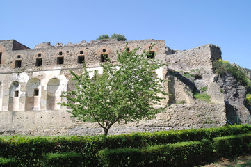 Fototapeta premium The city of Pompeii buried under a layer of ash by the volcano Mount Vesuvius