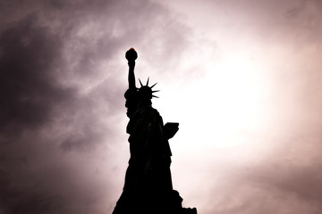 November 2018 - Backlight view of American symbol Statue of Liberty silhouette in New York, USA.