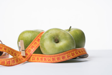 Green apples isolate. Diet. Product for diet. apples and centimeter.