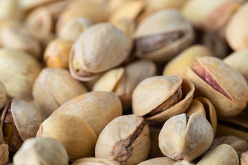 Pistachio texture. Nuts. Green fresh pistachios as texture. Close-up.