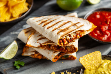 Chicken quesadillas with paprika, cheese and cilantro