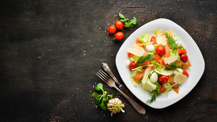 Caesar salad with salmon and Parmesan cheese. Top view. free copy space.