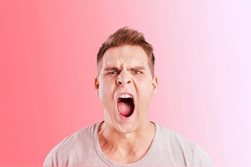 Angry man screaming isolated on background