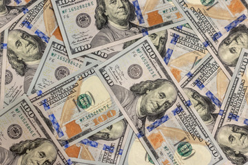 Pile of new design US dollar bills as background. Top view point
