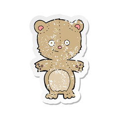 Naklejka premium retro distressed sticker of a cartoon teddy bear