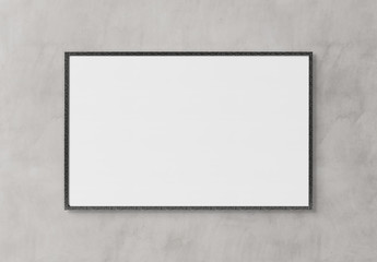 Black rectangular horizontal frame hanging on a white wall mockup 3D rendering