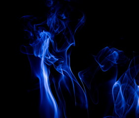 Blue smoke on black background