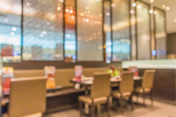 Cafe Restaurant interior with table blur abstract background with bokeh light