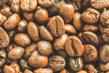 Roasted coffee beans closeup texture background