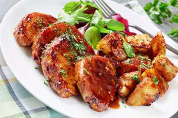 grilled sticky glazed Pork cutlets on a plate